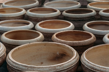 a lot of empty pots on ground