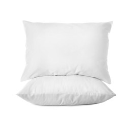 Clean soft bed pillows on white background