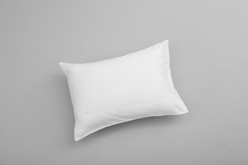 Clean soft bed pillow on grey background, top view