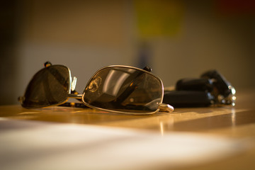 Sunglasses on desk