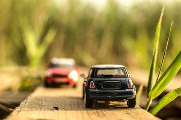 Fototapeta na wymiar red and blue car in miniature oncoming traffic