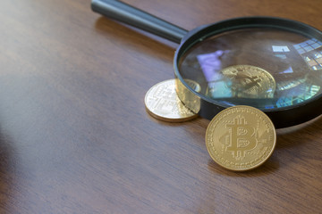 Magnifying Glass With Bitcoin Coins