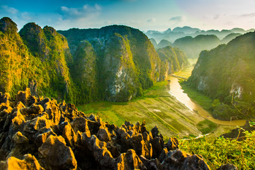 Beautiful sunset landscape viewpoint from the top of Mua Cave mountain, Ninh Binh, Tam Coc in...