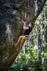 Male climber climbing overhanging rock,Outdoor active lifestyle