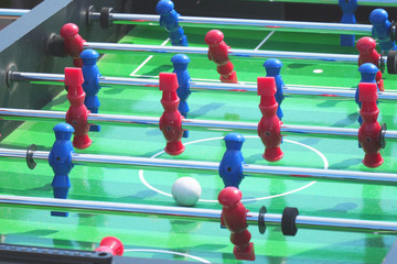 People play kicker table football soccer