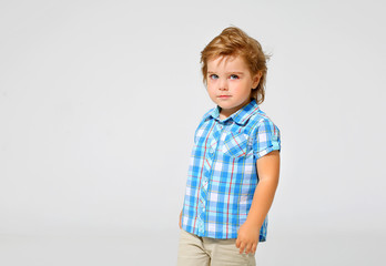 Portrait of a charming boy in a shirt