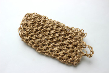 Natural jute fiber sponge isolated on white background