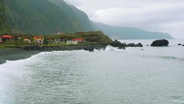 Up view of waves of ocean from cliffy shore of the north of Madeira