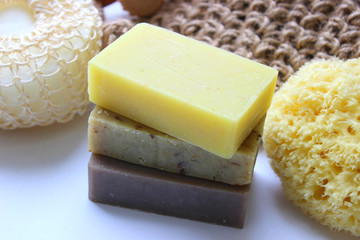 Spa set, hand-made soap stack, essential oil, sponge, candles, large sea salt crystals. The interior of the Spa, sauna, bathroom.