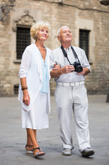 Senior couple enjoying walk around town