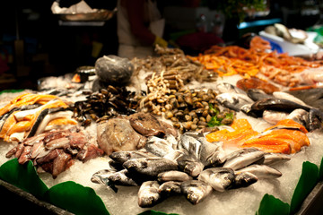 The counter on the market, seafood on ice, mussels,salmon, snapper. The Boqueria Market in Barcelona, Spain.