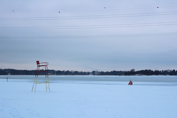 Empty winter beach with lifeguard chair - Powered by Adobe