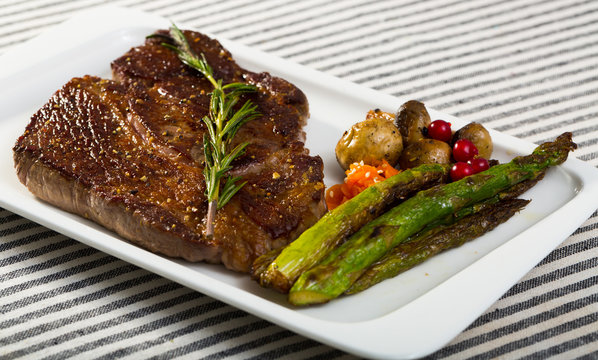 Fried  steak entrecote  of beef  with mushroom and asparagus