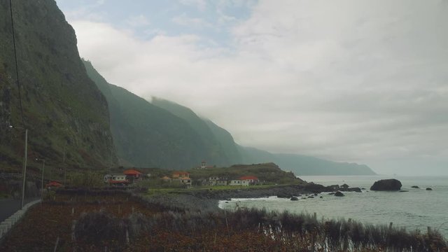 Up view of waves of ocean from cliffy shore of the north of Madeira