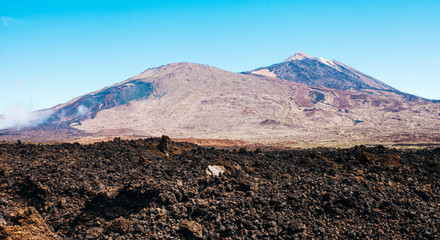 Sunny landscape of highest point of Spain with volcano and lava leftovers , Mount Teide, Tenerife