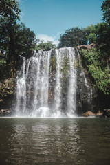 Llanos de Cortez waterfall in Bagaces, Costa Rica with heavy flow during rainy season