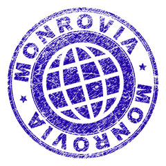 MONROVIA stamp imprint with grunge texture. Blue vector rubber seal imprint of MONROVIA text with grunge texture. Seal has words arranged by circle and planet symbol.
