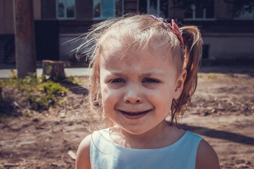 Close-up portrait of a little girl getting dirty in ice cream