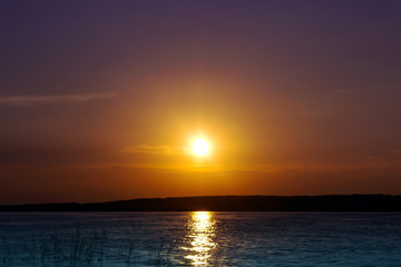 sunset over the river bank