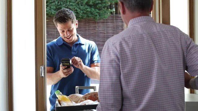 Driver Delivering Online Grocery Order To House