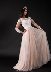  Full length of a beautiful bruenette woman in wedding dress