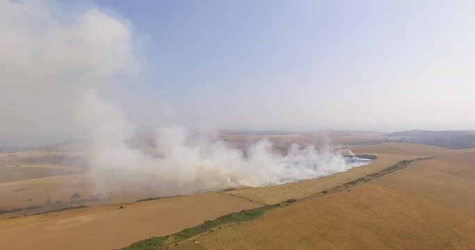 Aerial footage of a grassland fire at Friston, East Sussex