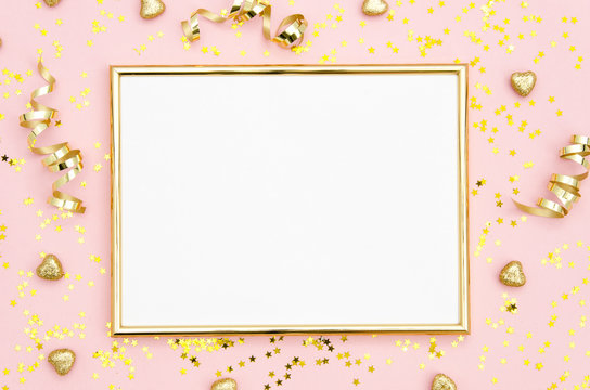 Photo frame mock up with space for text, golden sequins confetti on pink background. Lay Flat, top view. Valentine's minimal flatly background.