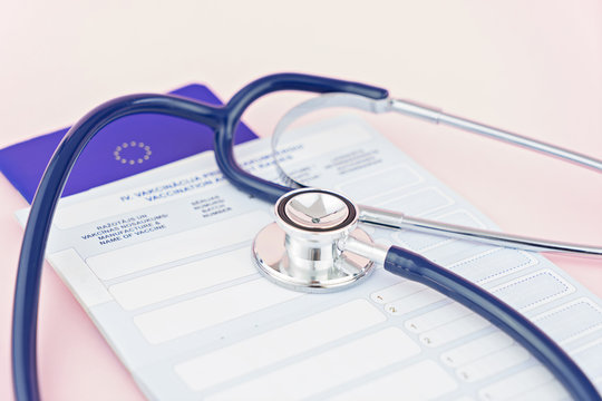 Stethoscope and pet animal vet passport. Time to do the vaccination. The concept of preparing pet for travel. First puppy vaccination and pet care, shallow depth of field