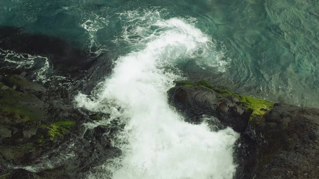View of mountain stream going into atlantic ocean on Madeira