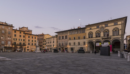Fototapeta na wymiar Beautiful view of Piazza San Michele at blue hour, with the moon in the sky, Lucca, Tuscany, Italy, Europe