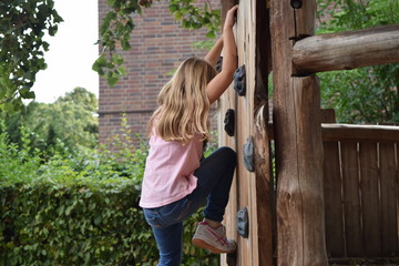 7 year old Girl climbing in kindergarten