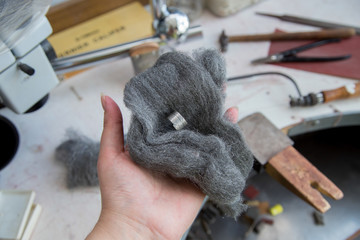 Jeweller's tools - steel wool, pliers, cutters, carving knives, moulds, raw silver  pieces, engraver, sander, jeweler's bench pin