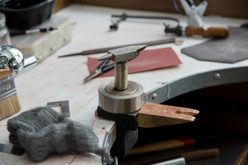 Jeweller's tools - pliers, cutters, carving knives, moulds, raw silver  pieces, engraver, sander, jeweler's bench pin