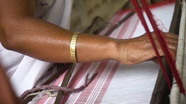Woman Weaving Traditional Shawl Fabric In Assam, India