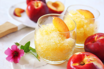 Peach granita and red fruits, frozen summer dessert
