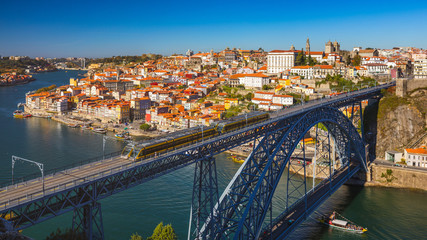 Obraz premium Panoramic view of Old city of Porto (Oporto) and Ribeira over Douro river, Portugal. Concept of world travel, sightseeing and tourism.