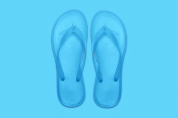 Flip flops abstract minimal blue background. Summer concept.