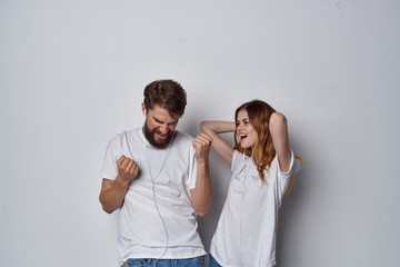 joyful young couple in white t-shirts logo white t-shirts