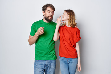 young couple in color t-shirt logo