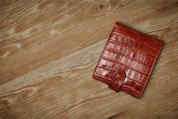 Leather wallet on wooden table