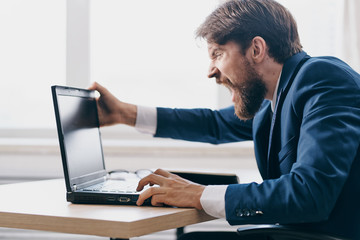 angry business man with laptop office