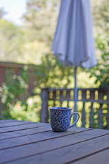 Mug in blue pattern on wooden table