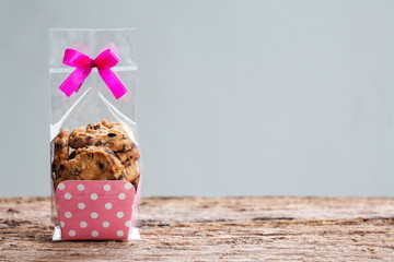 Chocolate chip cookies in plastic bag packaging with copy space.