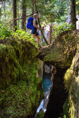 Adventurous woman is hiking in beautiful Canadian Nature during a sunny summer day. Taken in Squamish, North of Vancouver, BC, Canada.
