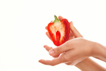 pepper in hands on an isolated background