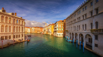 Rialto bridge in Venice, Italy. Venice Grand Canal. Architecture and landmarks of Venice. Venice postcard with Venice gondolas