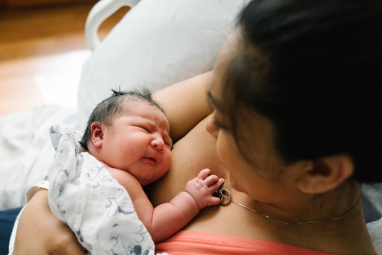 Mother bonding with newborn