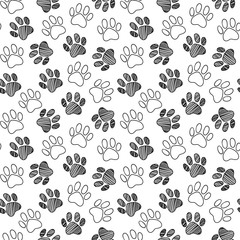 Monochrome black and white dog cat pet animal paw foot hand drawn ink sketch seamless pattern texture background vector © Silmairel