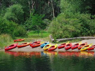 kayaks on beach for summer camp