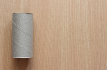 toilet paper on the wooden texture background, copy space.
